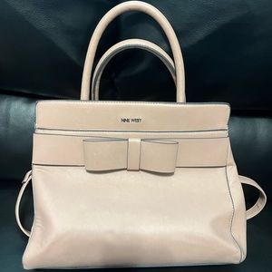 light pink nine west purse. Used twice sat in my closet after that alot of space